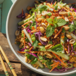 Crispy rice salad with vegetables and herbs in a white bowl