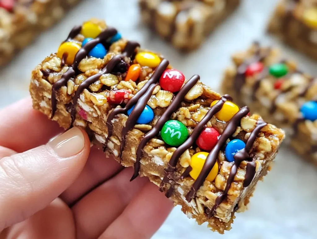 No-bake peanut butter granola bar with candy and chocolate drizzle